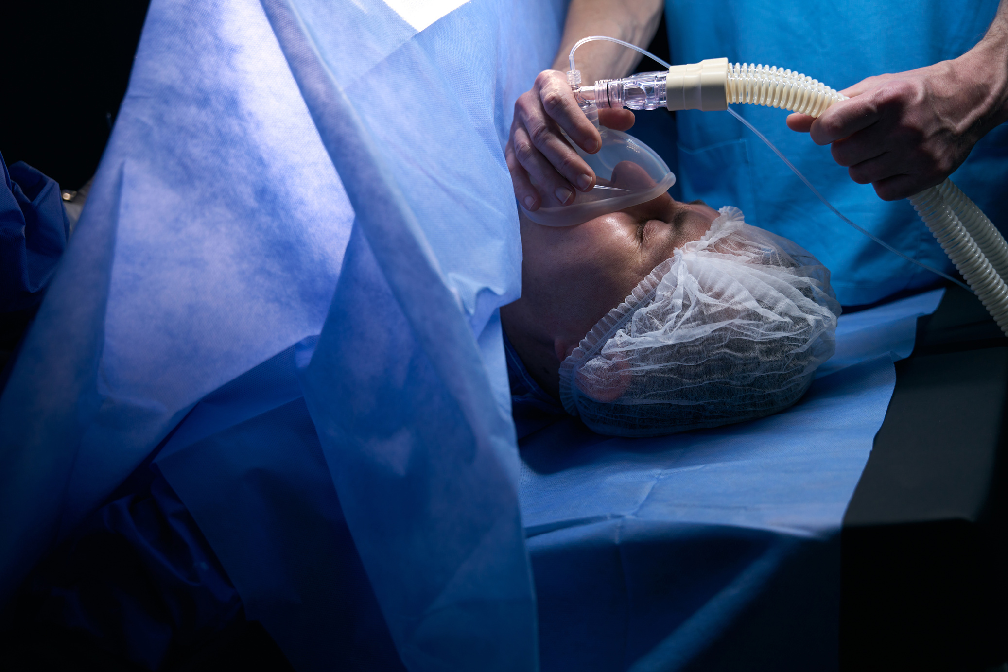 Woman lies on the operating table under anesthesia